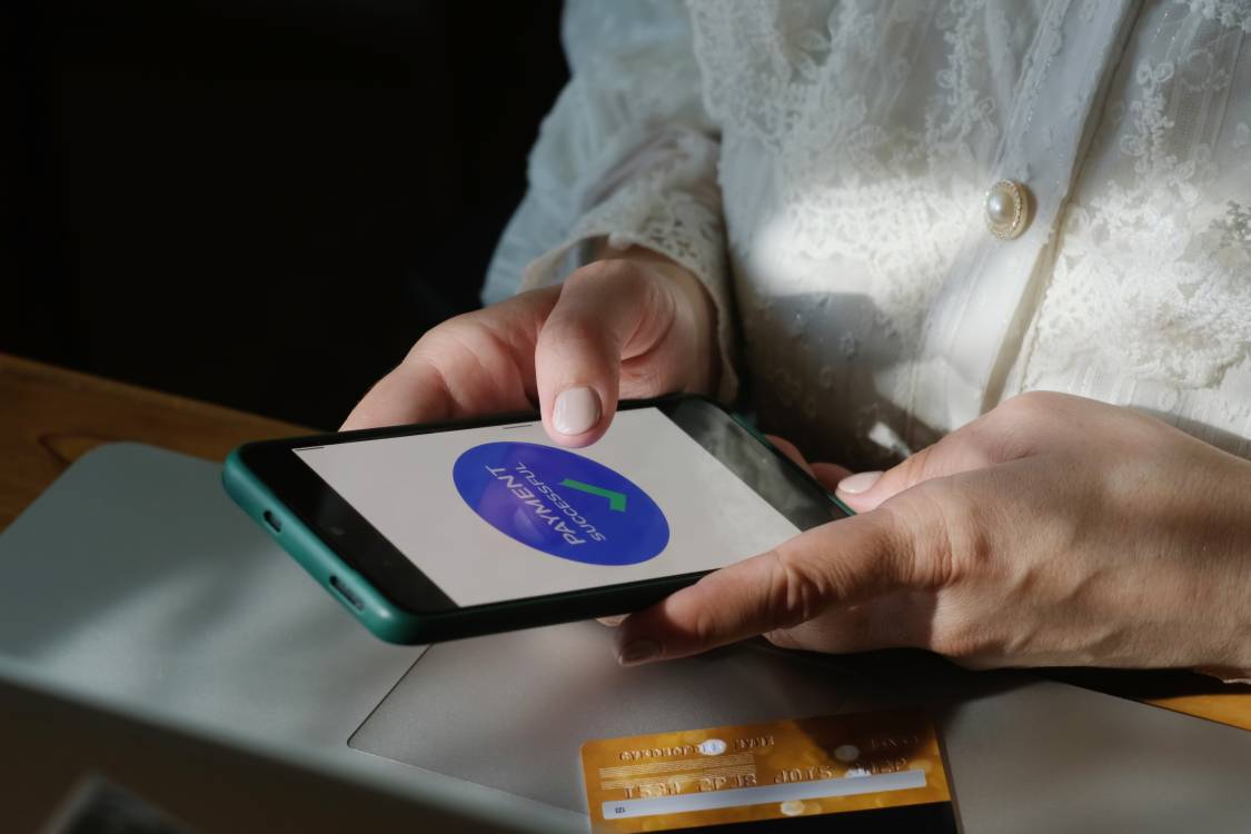 Making online payments with smartphone and plastic bank card.